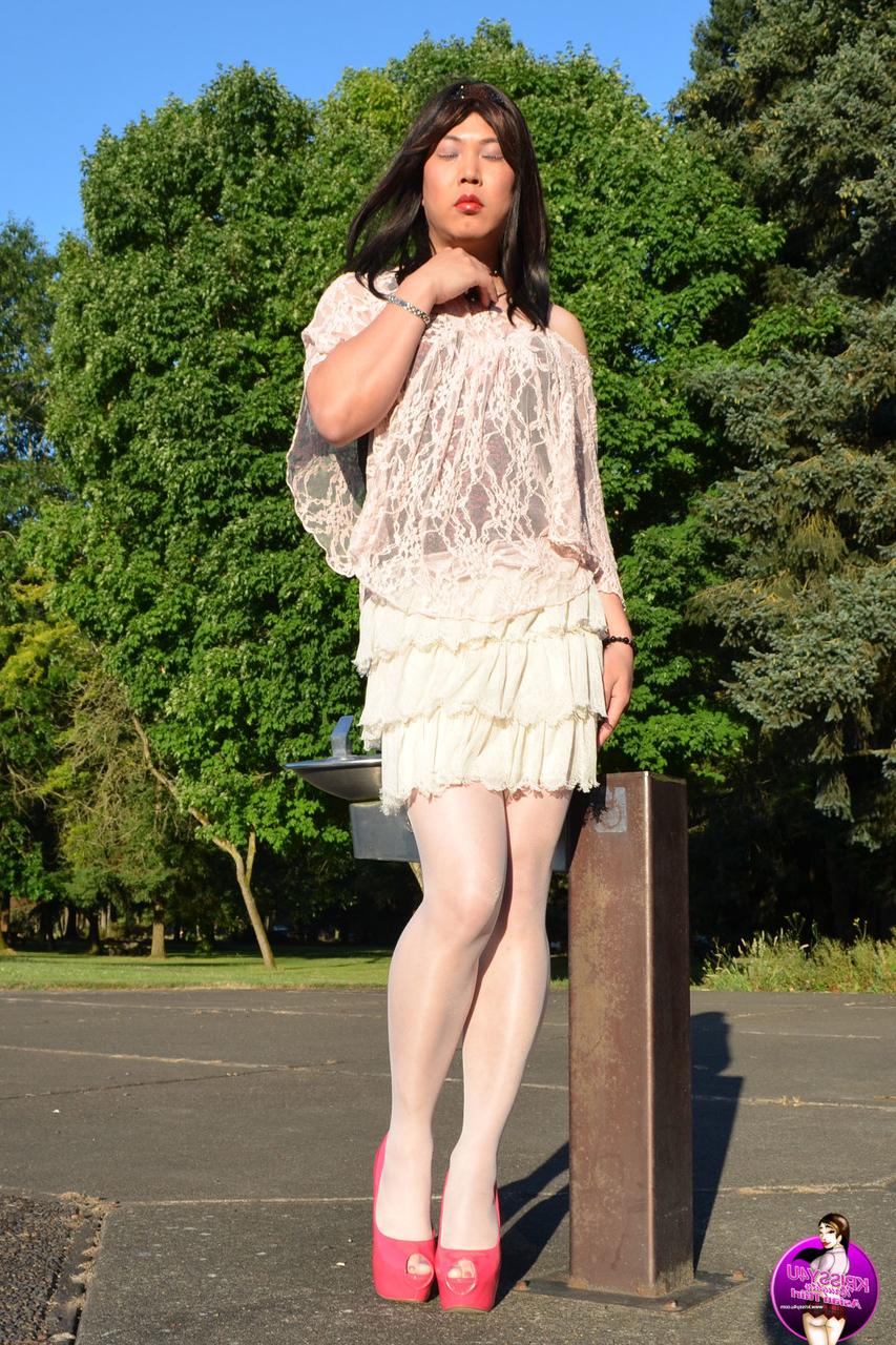 16P Slutty Asian shemale poses in a provocative outfit & high heels in public