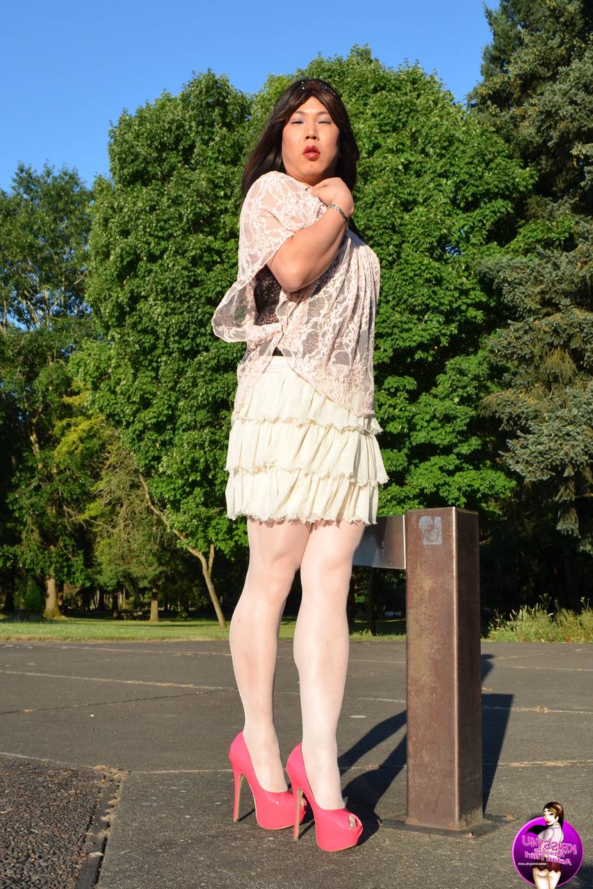 16P Slutty Asian shemale poses in a provocative outfit & high heels in public