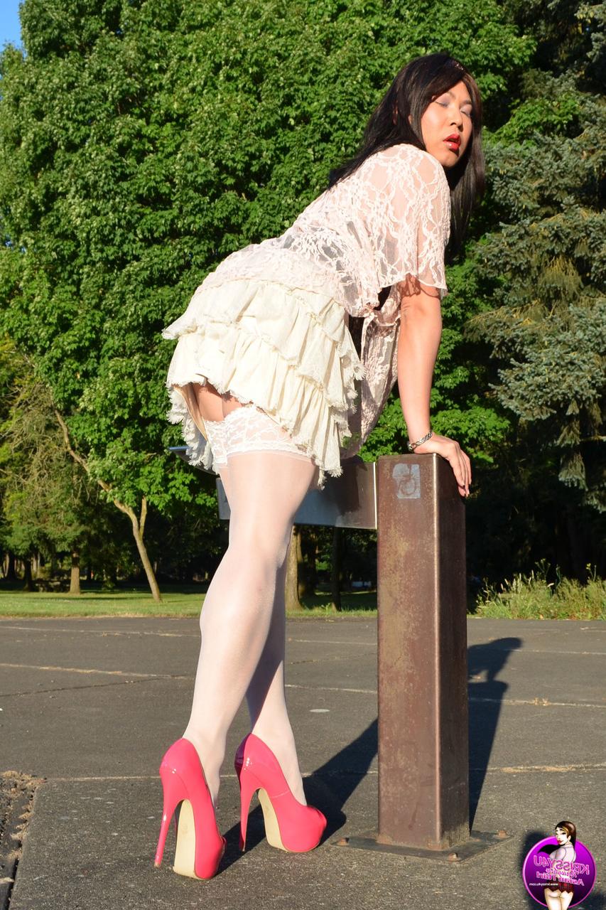 16P Slutty Asian shemale poses in a provocative outfit & high heels in public