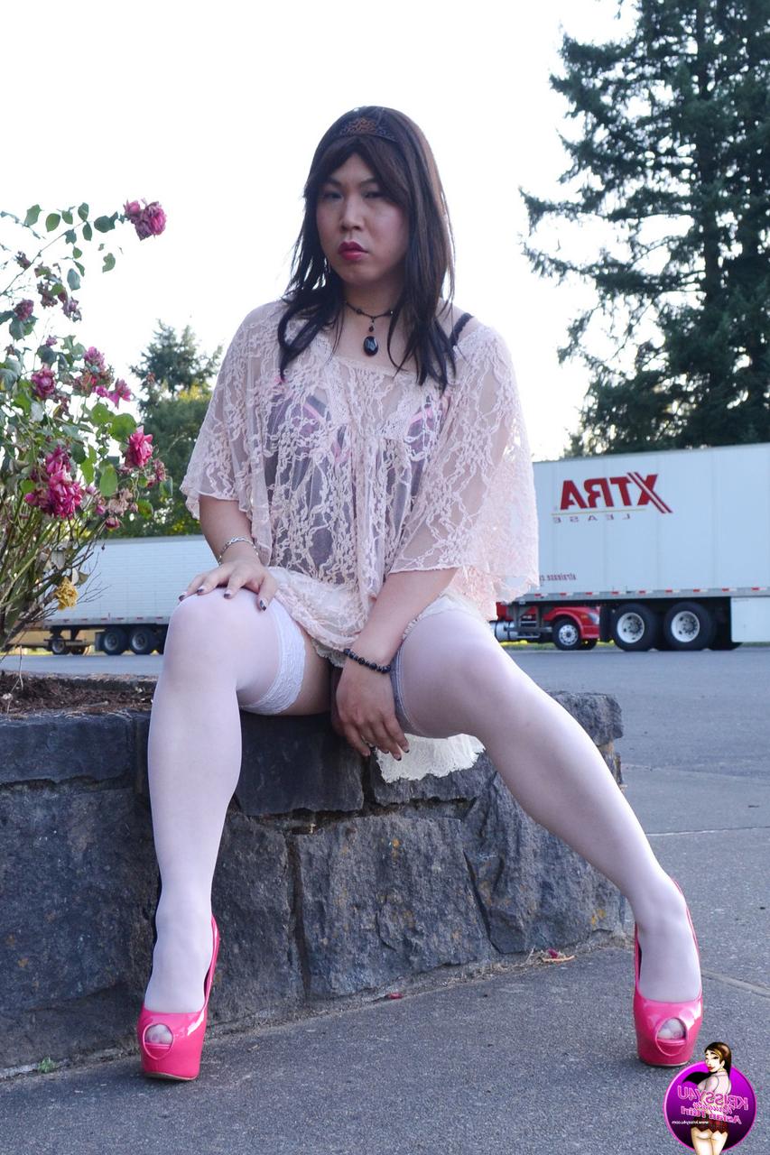 16P Slutty Asian shemale poses in a provocative outfit & high heels in public