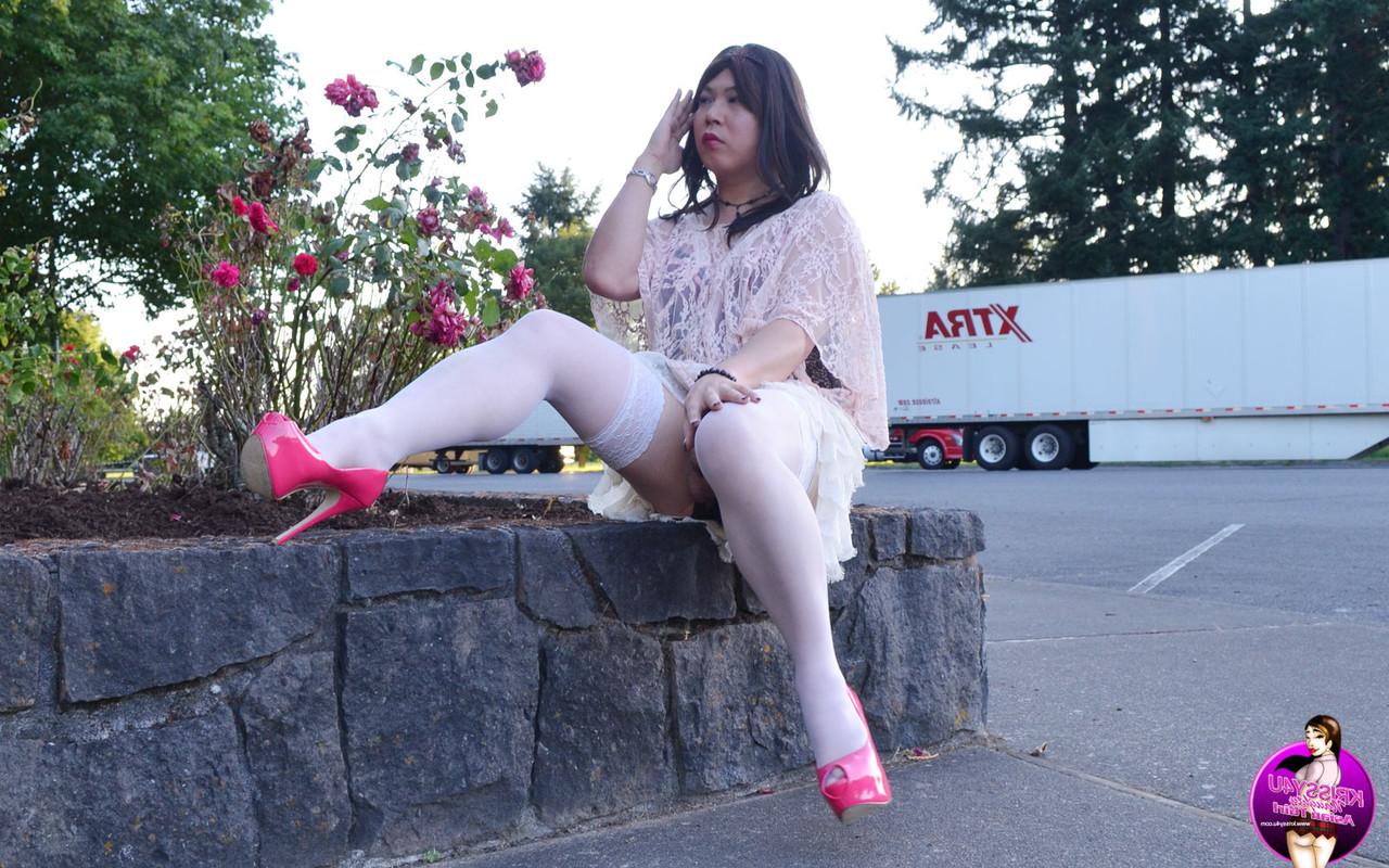 16P Slutty Asian shemale poses in a provocative outfit & high heels in public