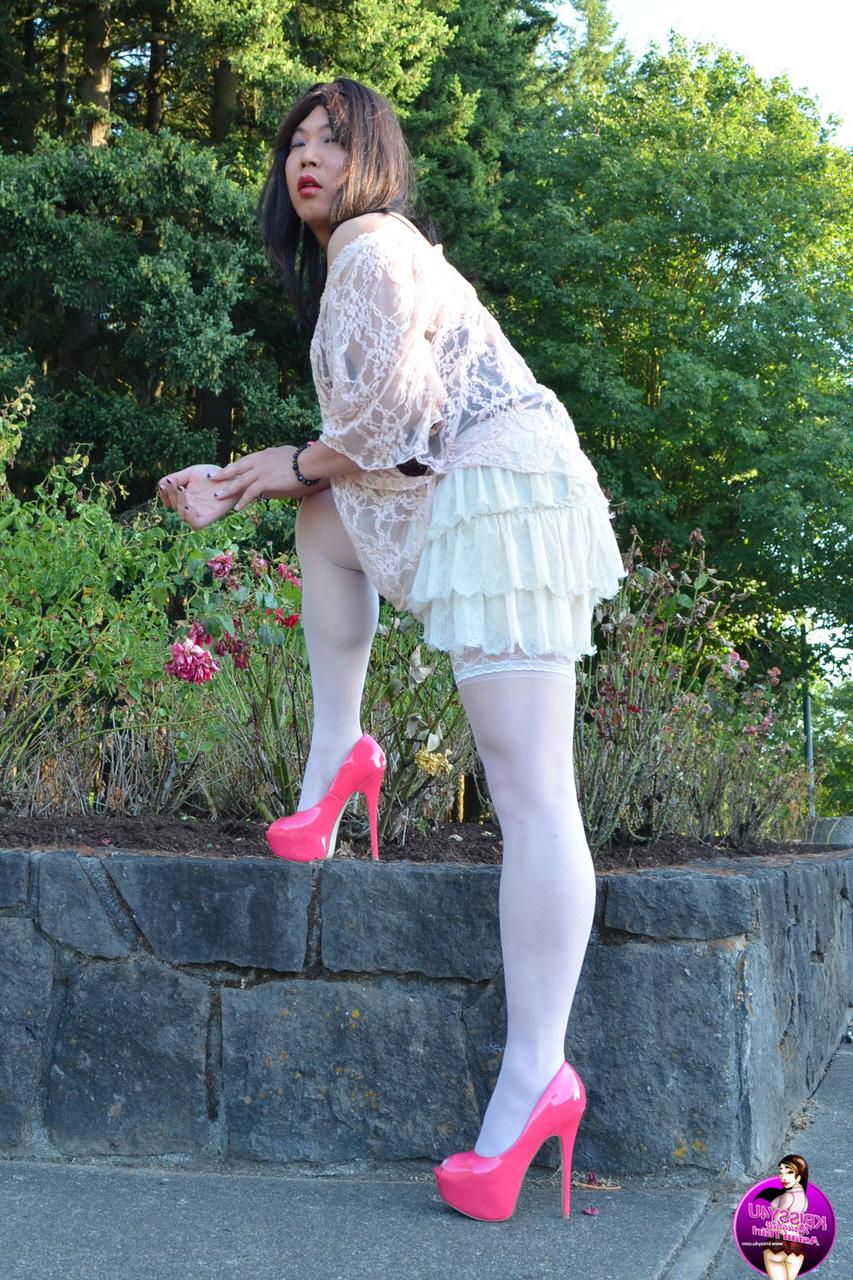 16P Slutty Asian shemale poses in a provocative outfit & high heels in public
