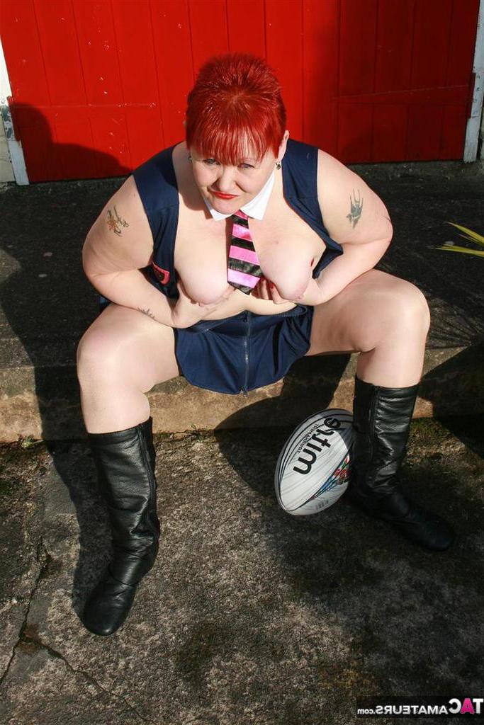20P Fat redhead Valgasmic Exposed exposes her tits while playing with a football