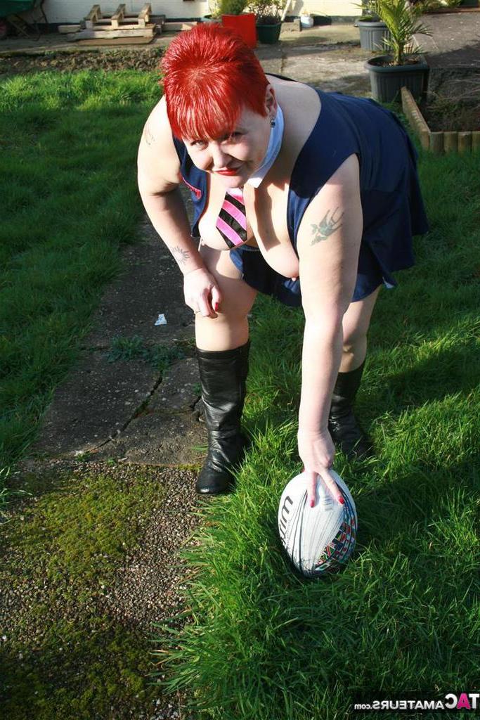 20P Fat redhead Valgasmic Exposed exposes her tits while playing with a football