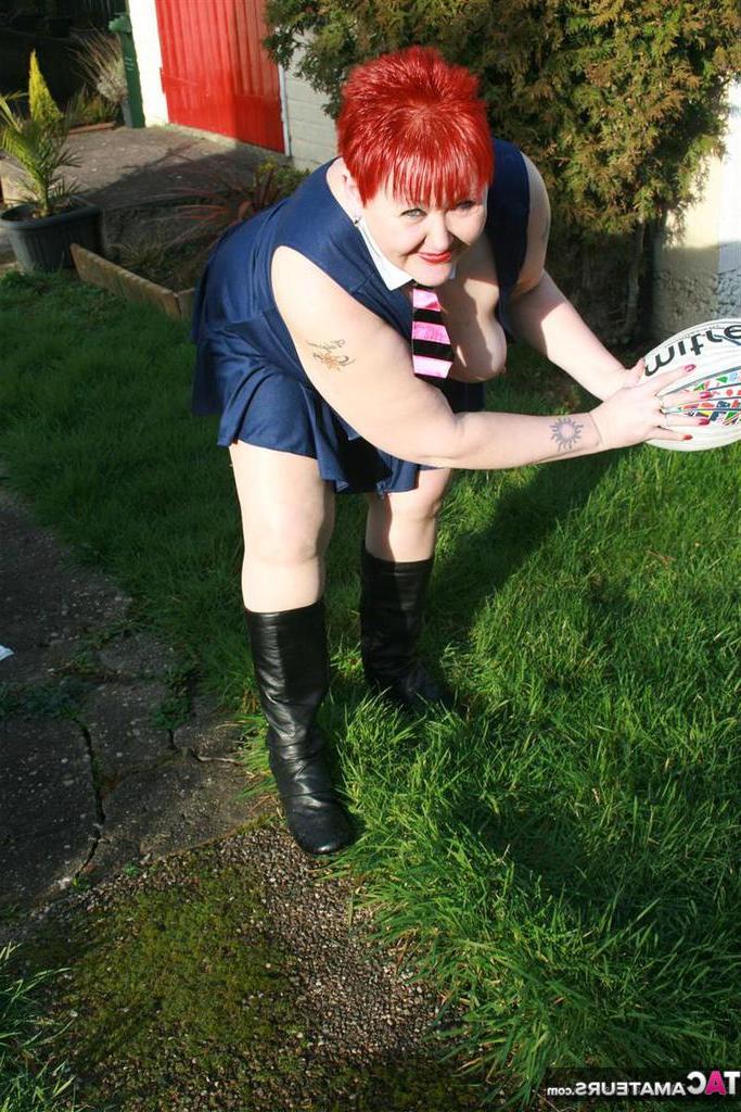 20P Fat redhead Valgasmic Exposed exposes her tits while playing with a football