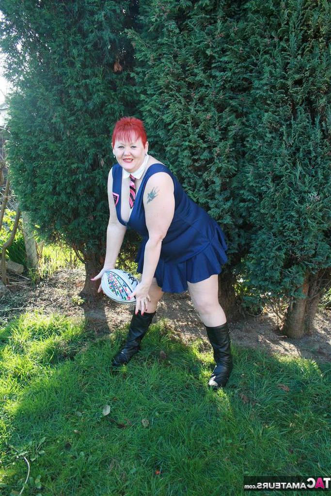 20P Fat redhead Valgasmic Exposed exposes her tits while playing with a football