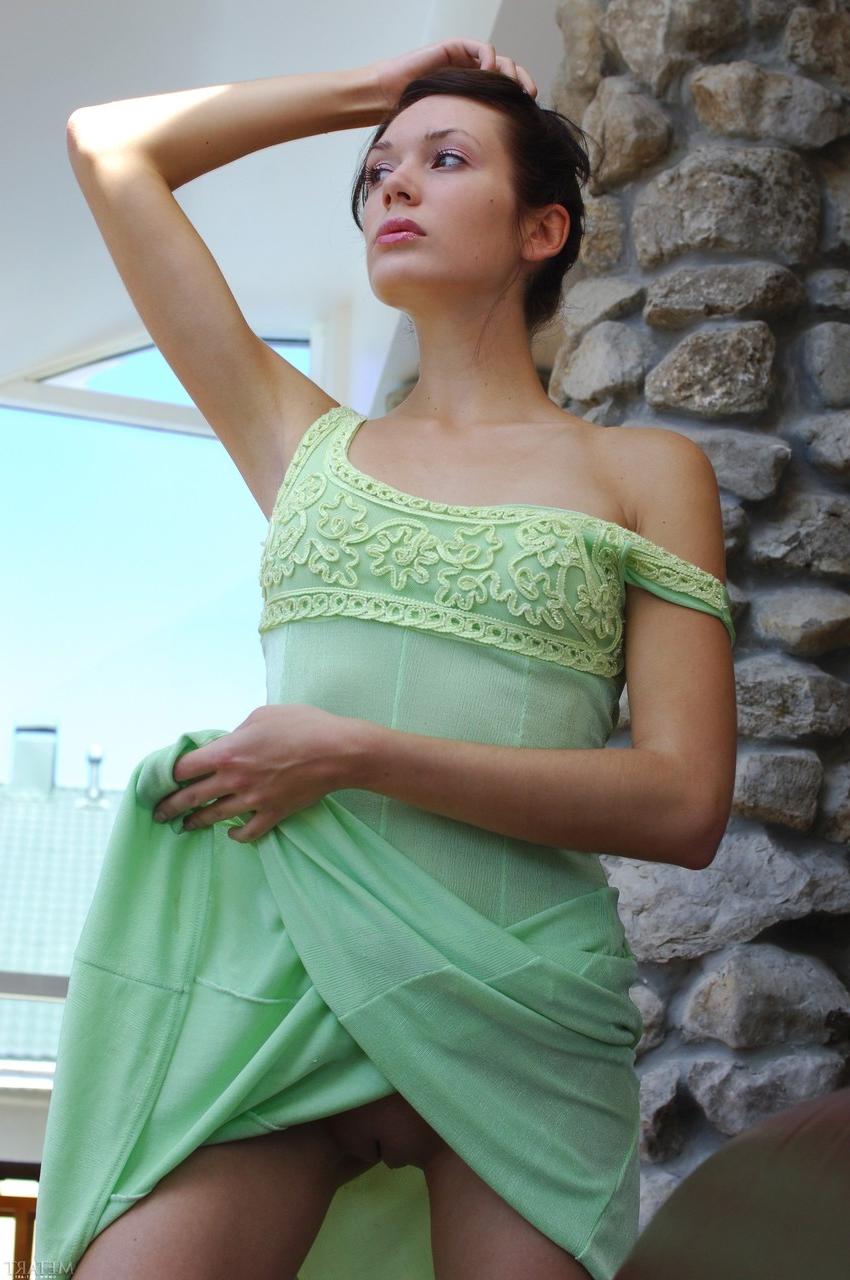 20P Dark-haired babe Anne B peels off her green dress and poses butt naked