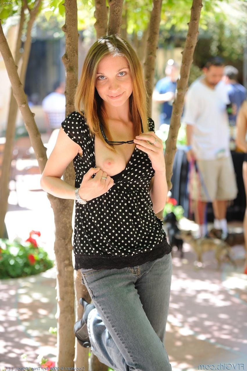 20P Gorgeous amateur babe strips in a public parking lot and poses naked
