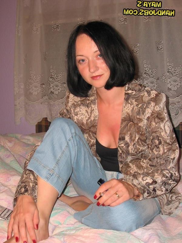14P Raven-haired babe Maya strips and touches herself while smoking a cigarette