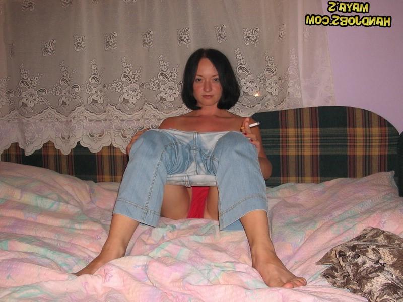 14P Raven-haired babe Maya strips and touches herself while smoking a cigarette