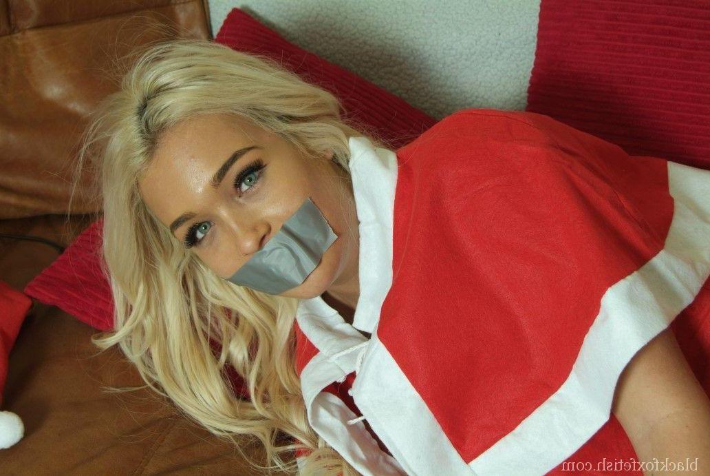 16P Beautiful blonde is silenced and restrained with duct tape in an Xmas outfit