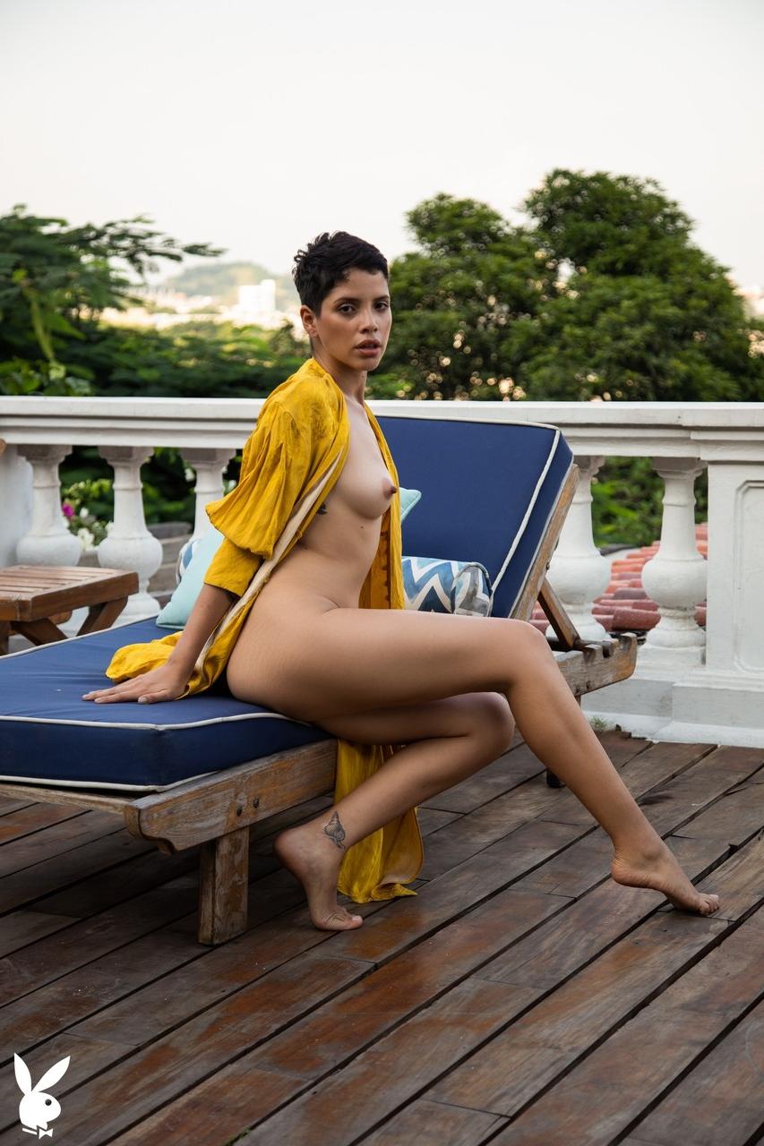 20P Short haired babe Alejandra La Torre flaunts her natural body poolside