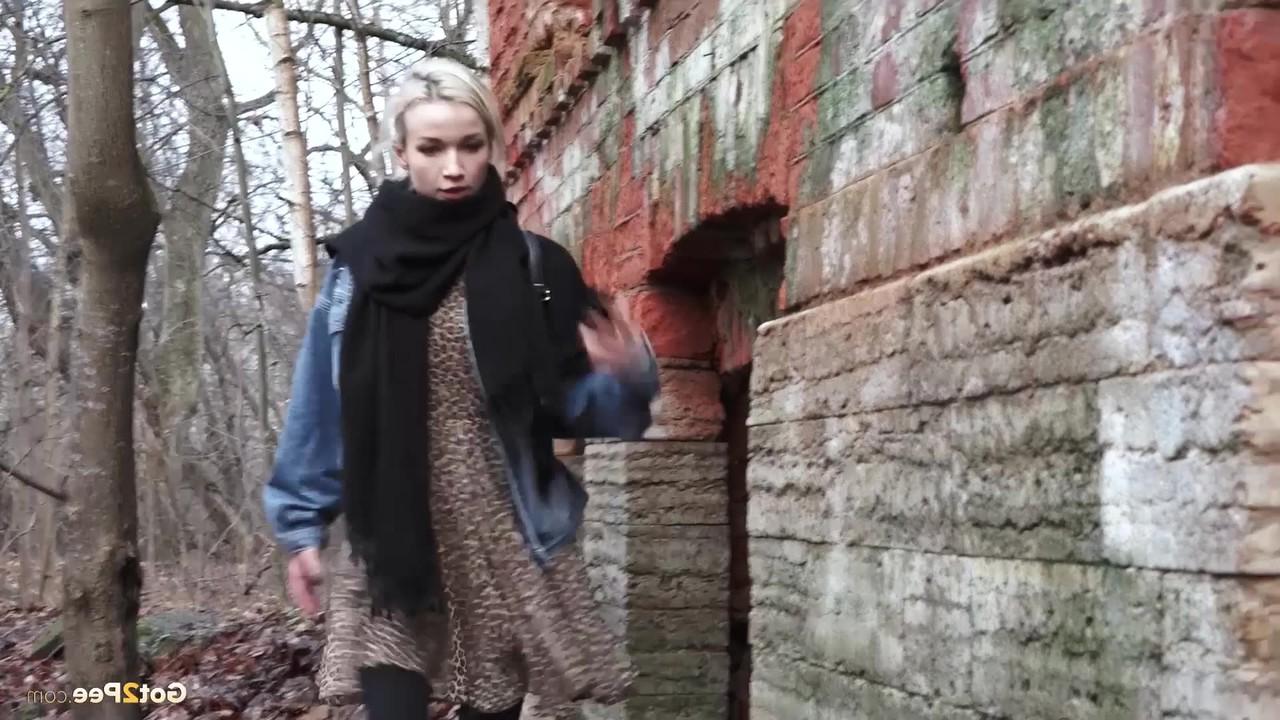 15P Pretty blonde Masha pulls down her tights for a piss by an abandoned building
