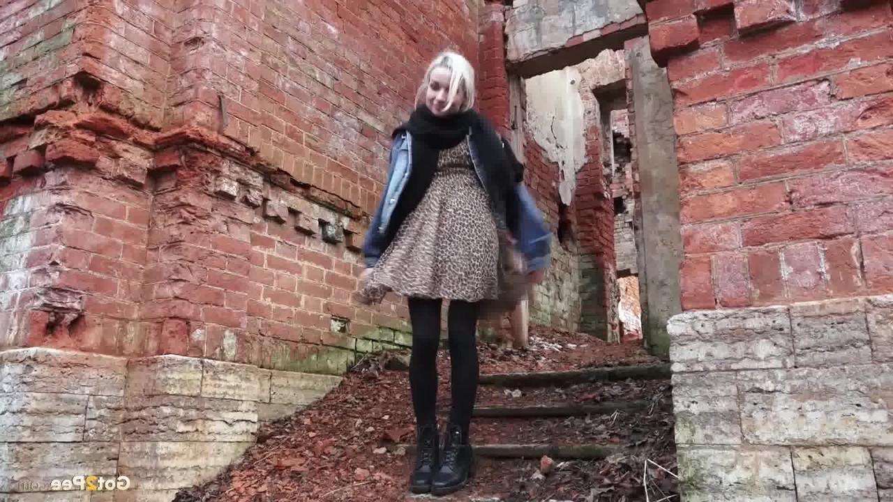 15P Pretty blonde Masha pulls down her tights for a piss by an abandoned building