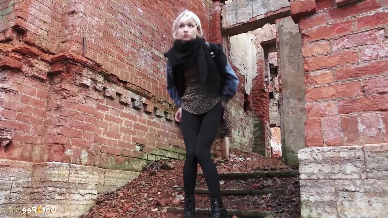 15P Pretty blonde Masha pulls down her tights for a piss by an abandoned building