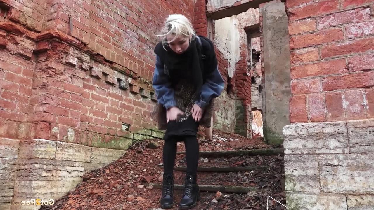 15P Pretty blonde Masha pulls down her tights for a piss by an abandoned building