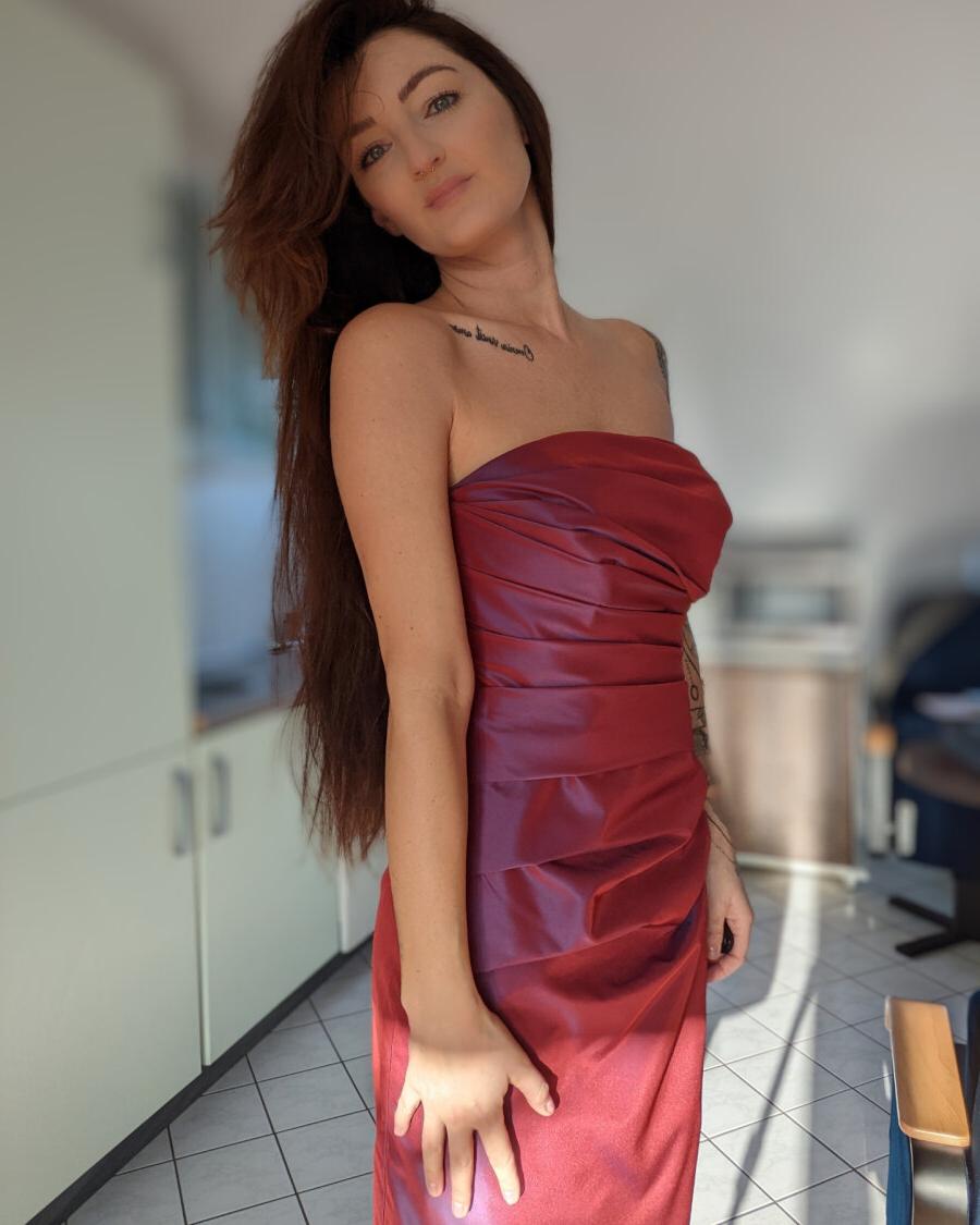 20P Seductive inked Lara Lauren teases with her covered big tits in a compilation