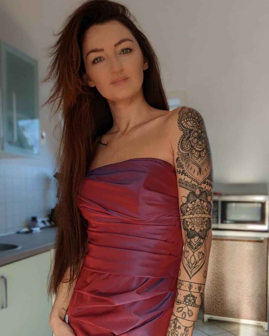 20P Seductive inked Lara Lauren teases with her covered big tits in a compilation