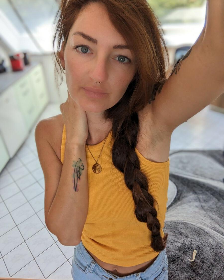 20P Seductive inked Lara Lauren teases with her covered big tits in a compilation