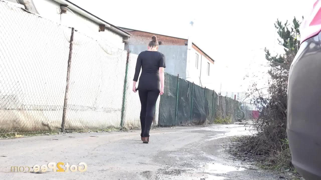 15P Caucasian girl Valentina Ross pees in a puddle during the day