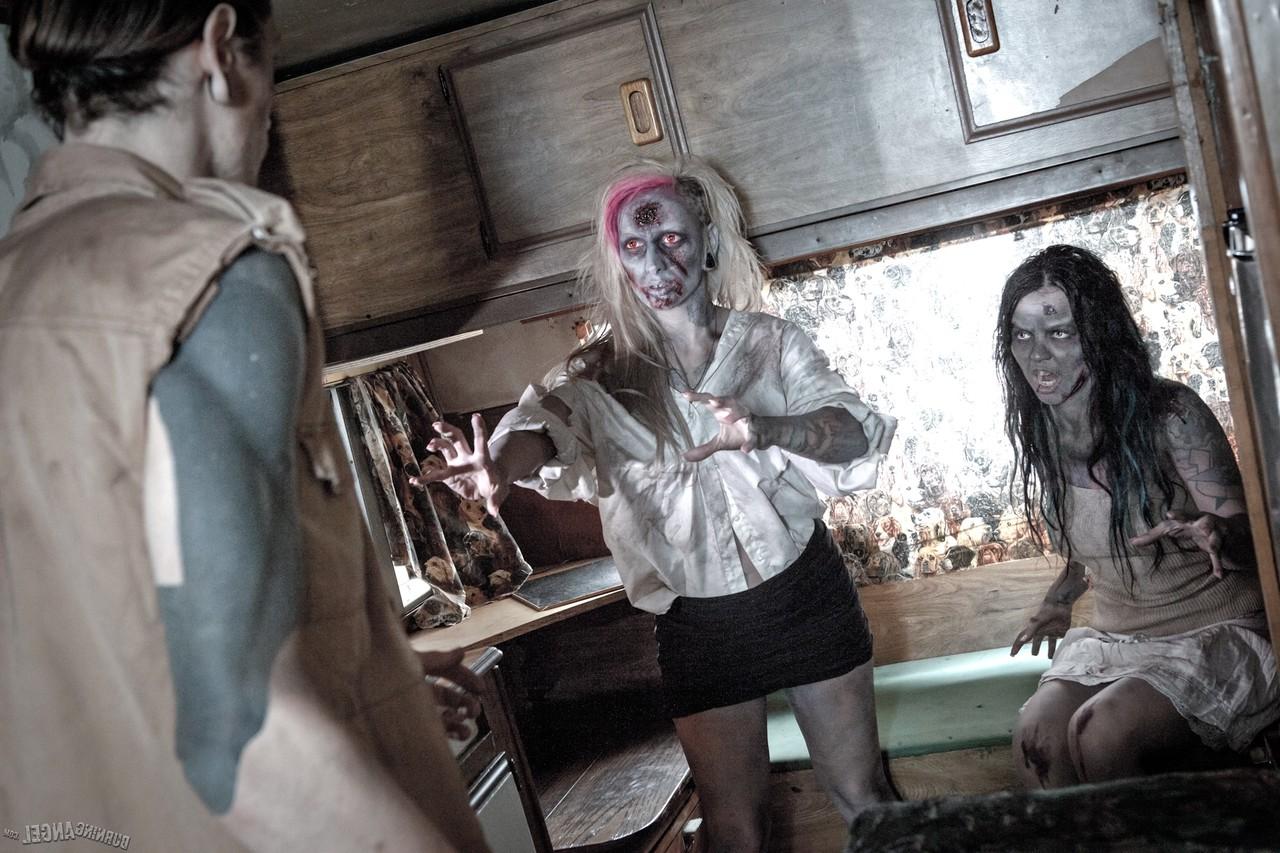 14P Fetish models Brittany Lynn and Jessie Lee giving head in Zombie threesome