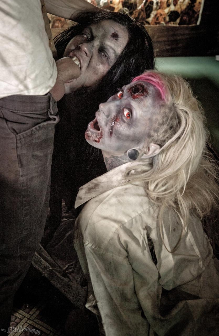 14P Fetish models Brittany Lynn and Jessie Lee giving head in Zombie threesome
