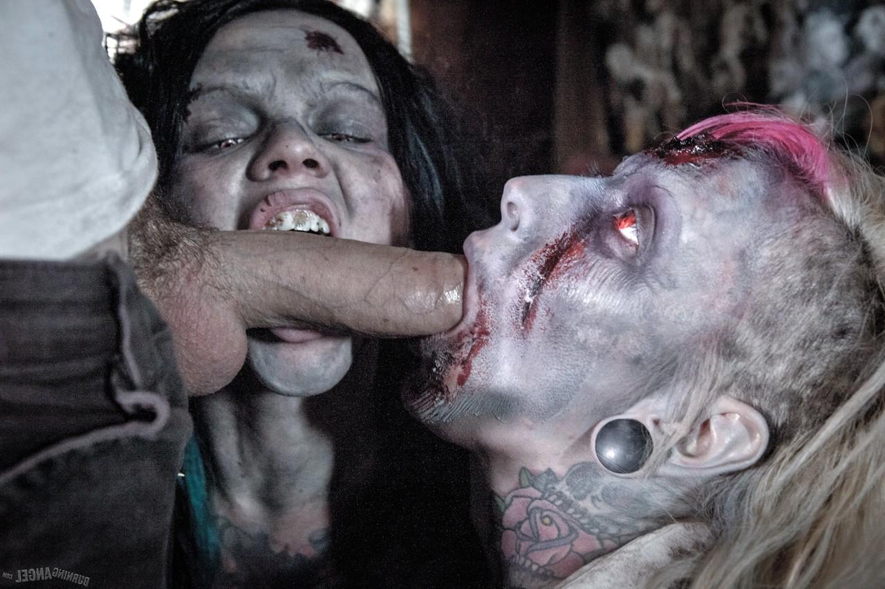 14P Fetish models Brittany Lynn and Jessie Lee giving head in Zombie threesome