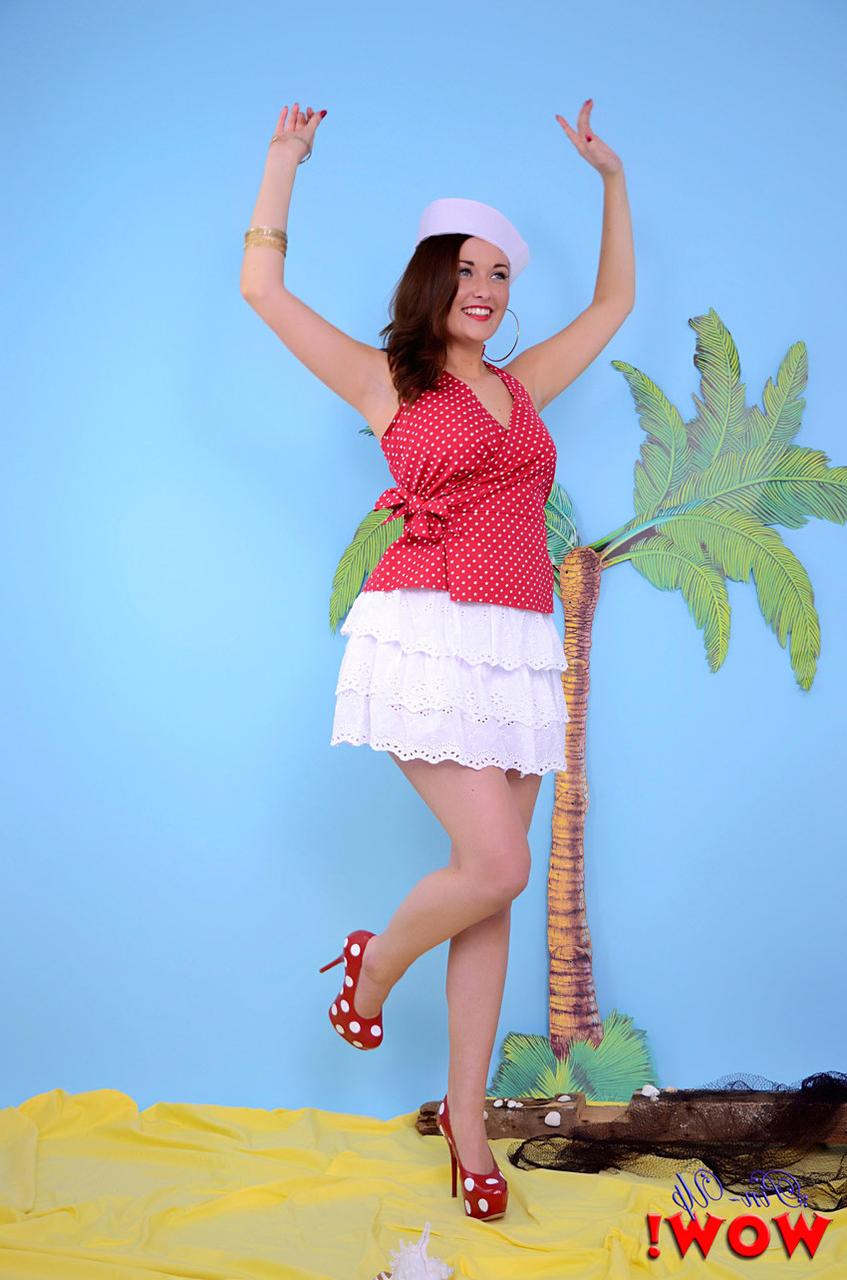 17P Pinup model uncovers her firm breasts while wearing polka-dot heels