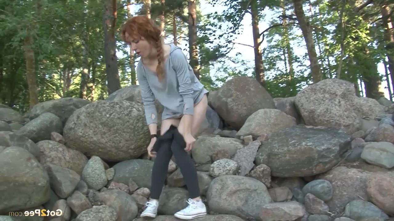 15P Natural redhead Ira takes a badly needed piss on boulders in the woods