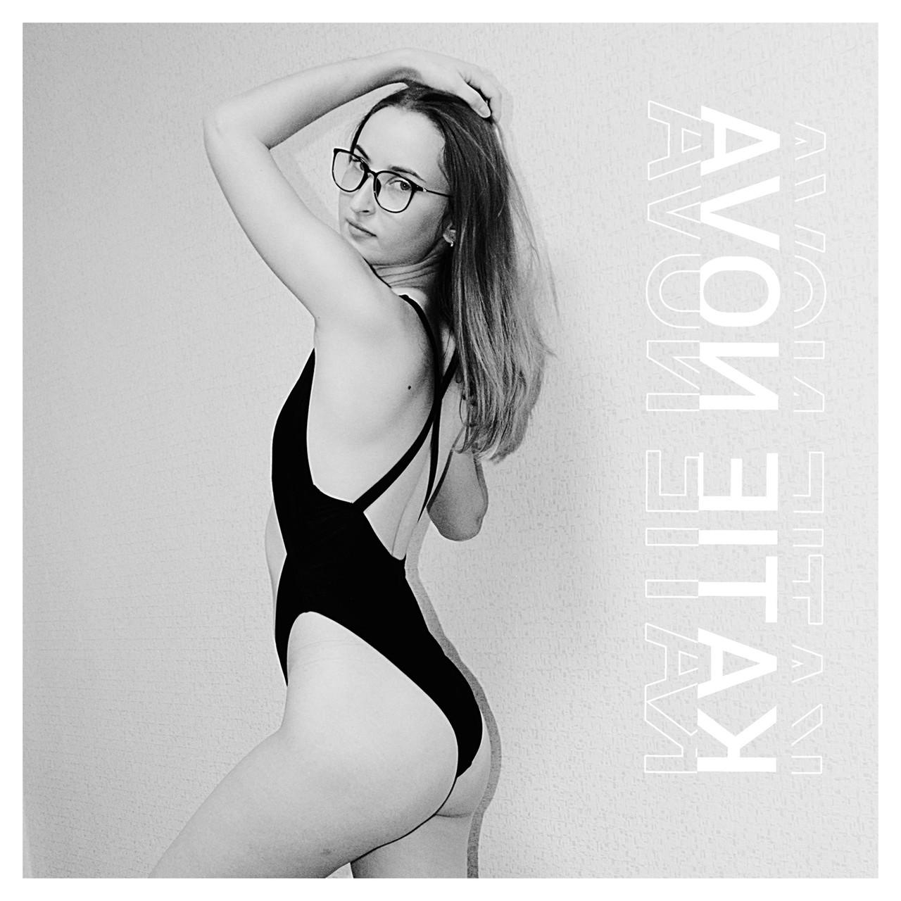 20P Attractive amateur model Katie posing in her black swimsuit in a solo
