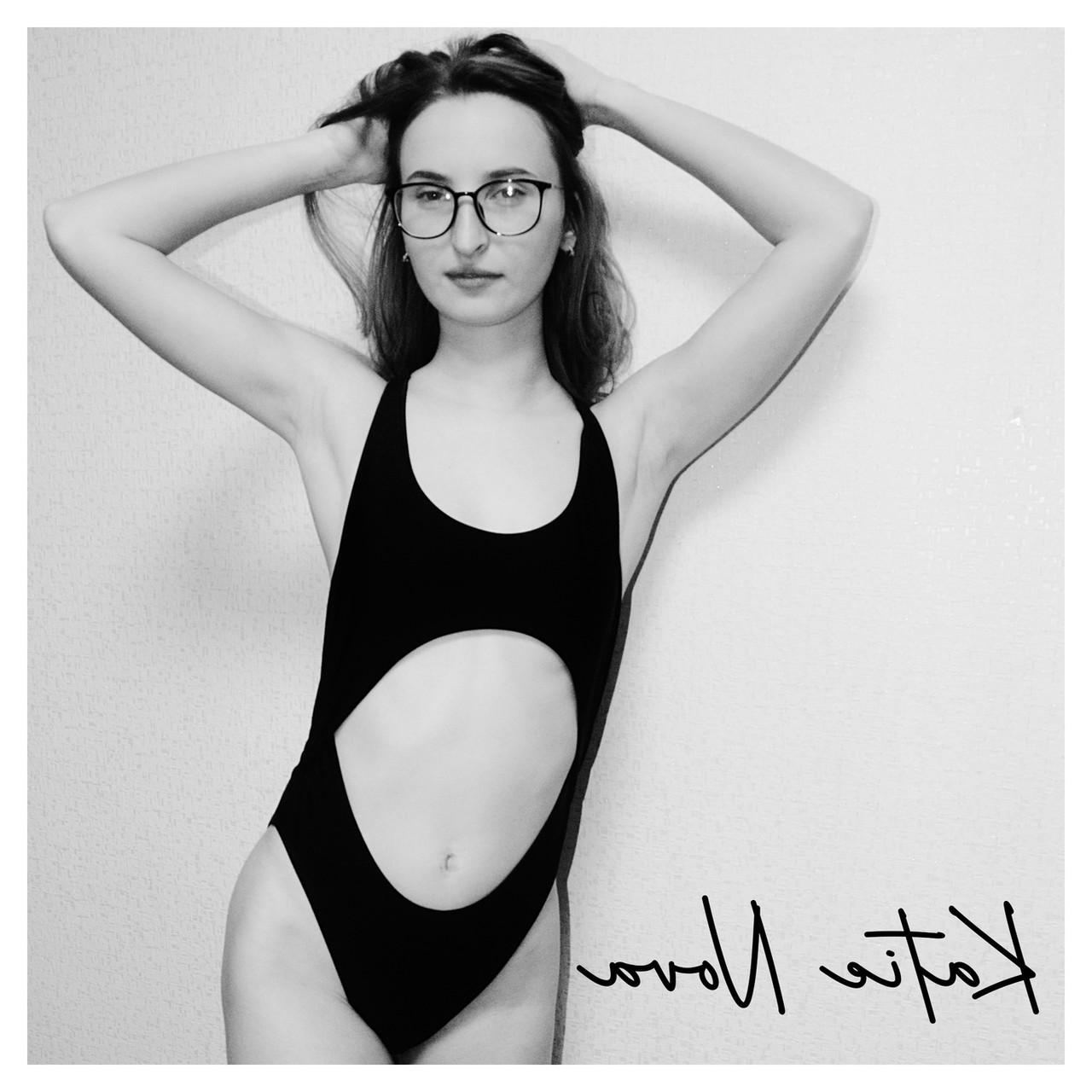 20P Attractive amateur model Katie posing in her black swimsuit in a solo