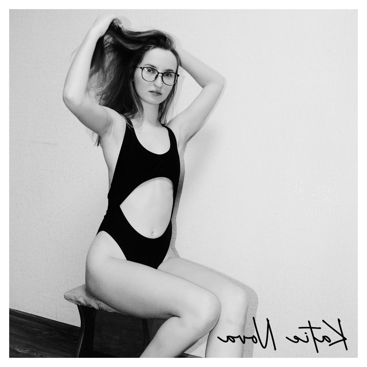 20P Attractive amateur model Katie posing in her black swimsuit in a solo