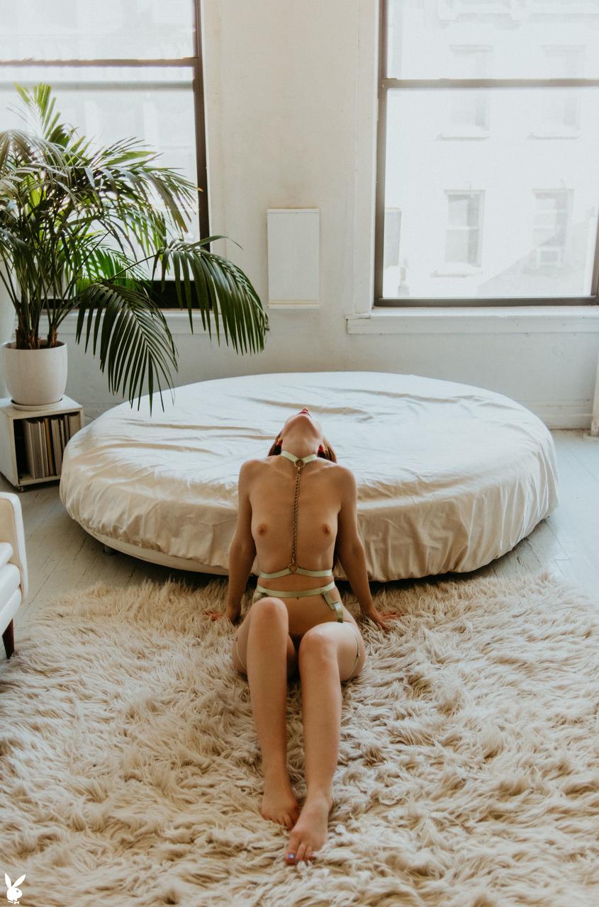 20P Naughty centerfold Erin OHara flaunts her small tits and incredible big booty