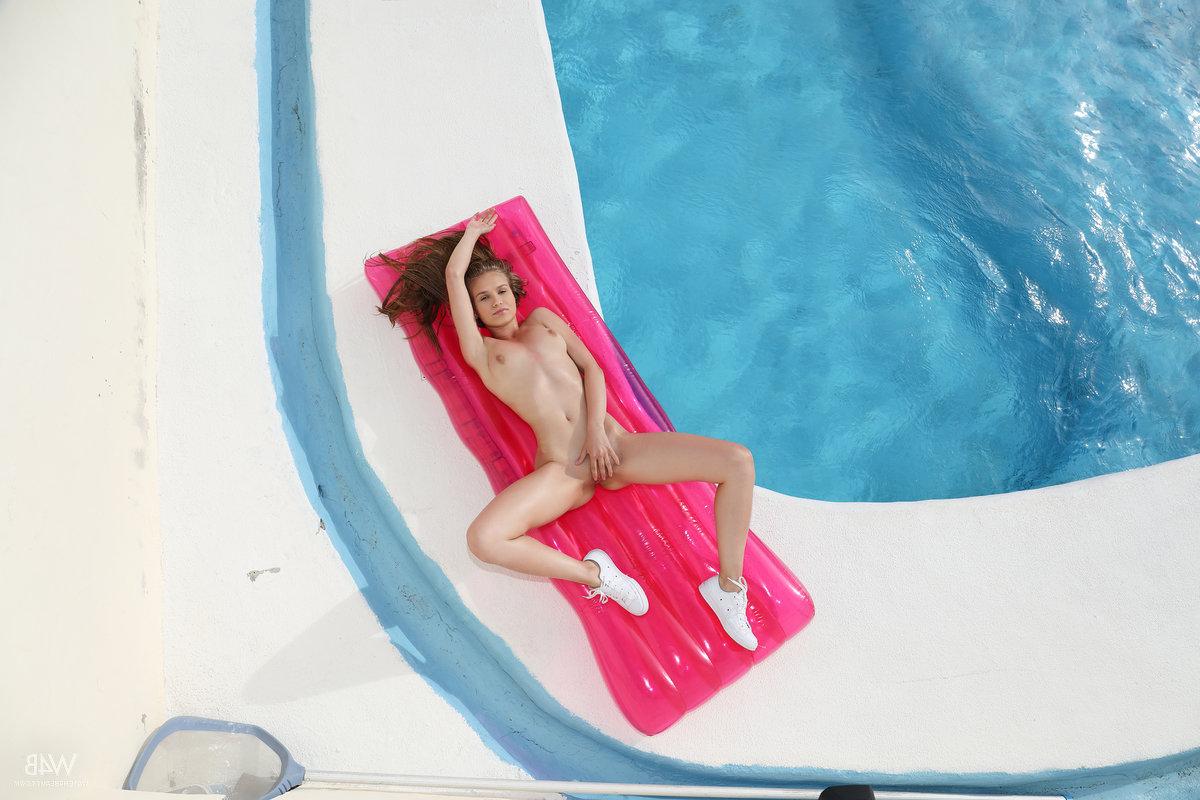 16P Bikini clad blonde Angel B gets naked to spread her pussy beside the pool