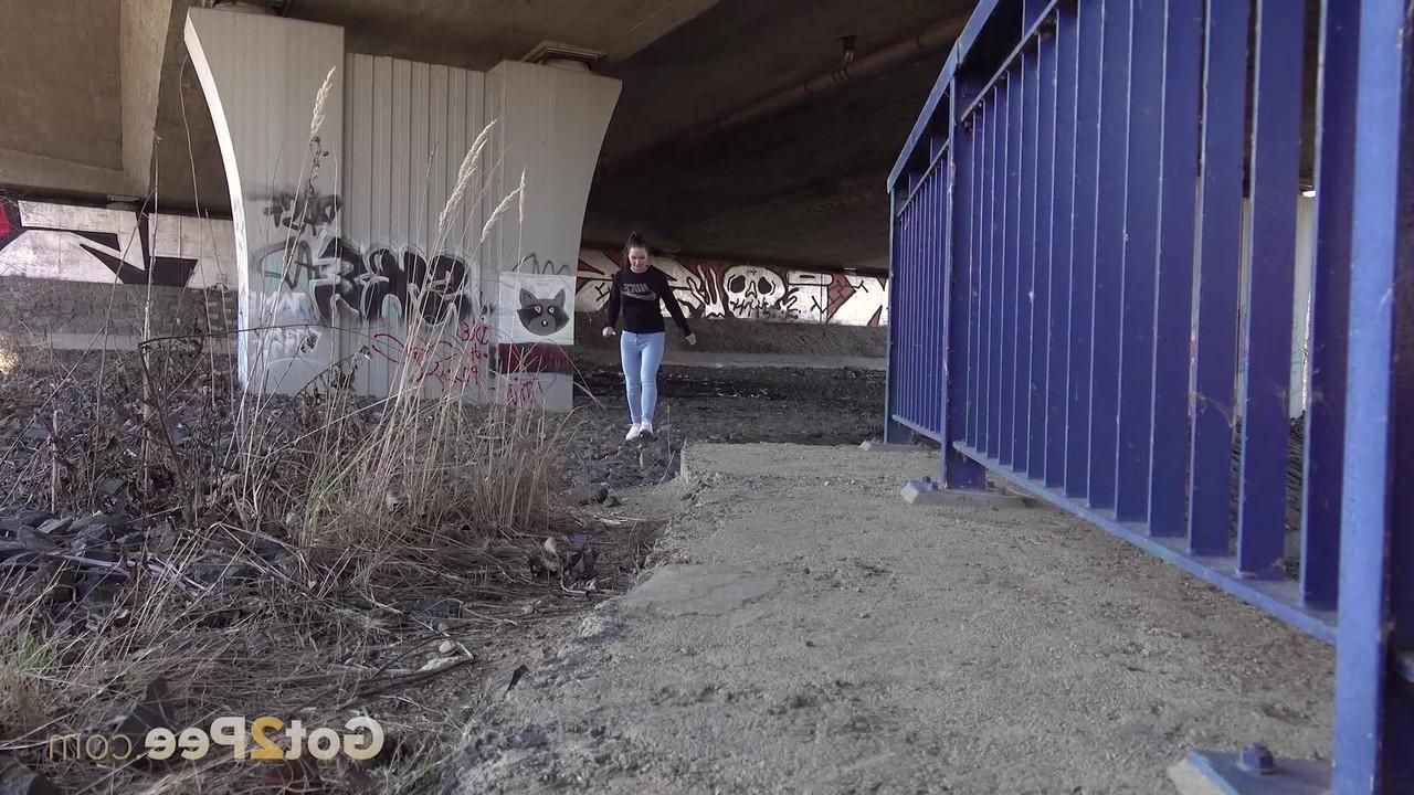 15P Dark haired girl Naomi Bennet takes a badly needed pee under an overpass