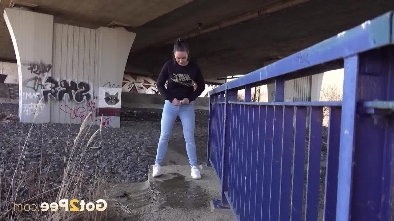 15P Dark haired girl Naomi Bennet takes a badly needed pee under an overpass