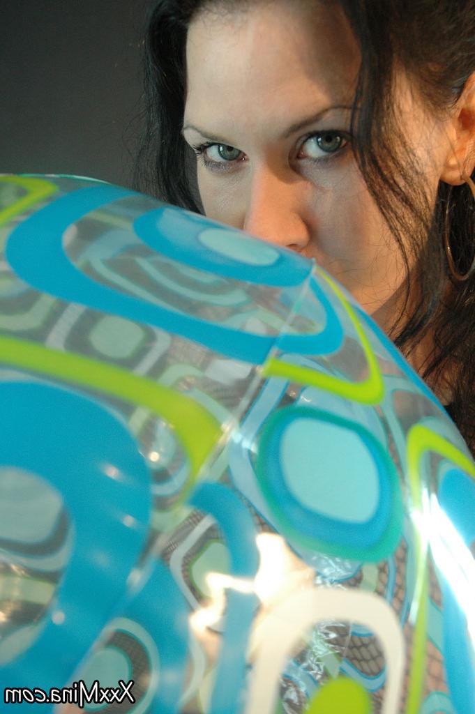 15P Brunette amateur Mina Gorey plays with balls while wearing a see-through top