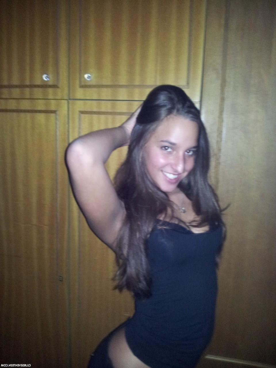 16P European teen Amira C poses enticingly while clothed in sexy outfits