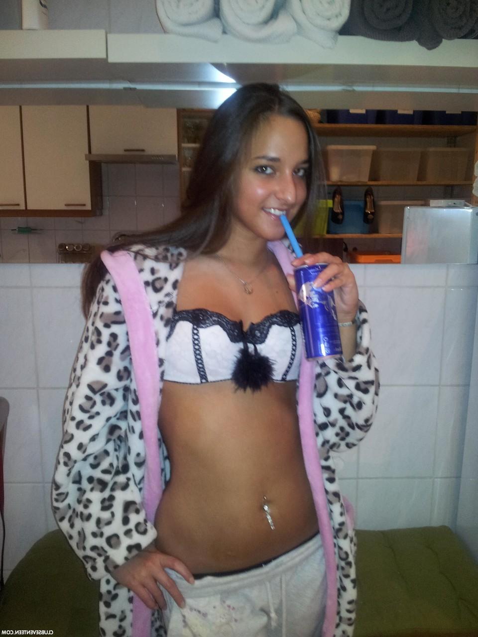 16P European teen Amira C poses enticingly while clothed in sexy outfits