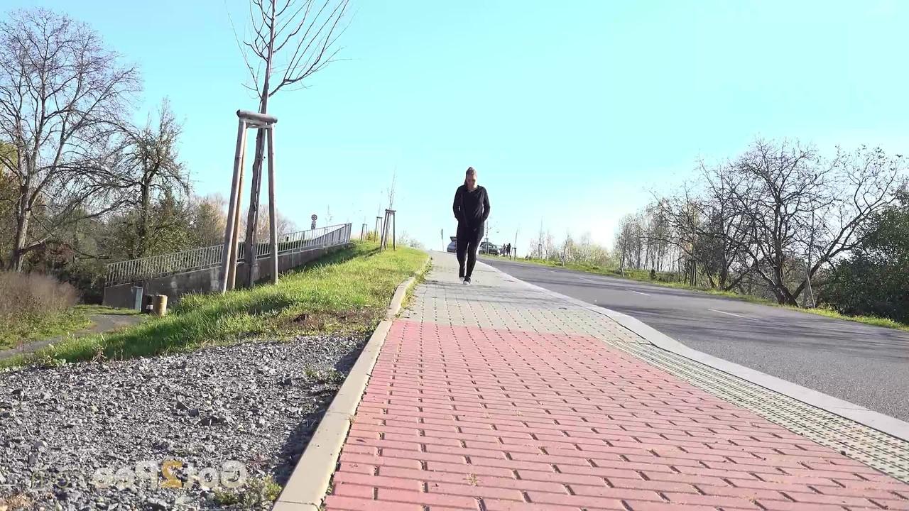 15P Caucasian girl Naomi Bennet pulls down black leggings to pee on a sidewalk