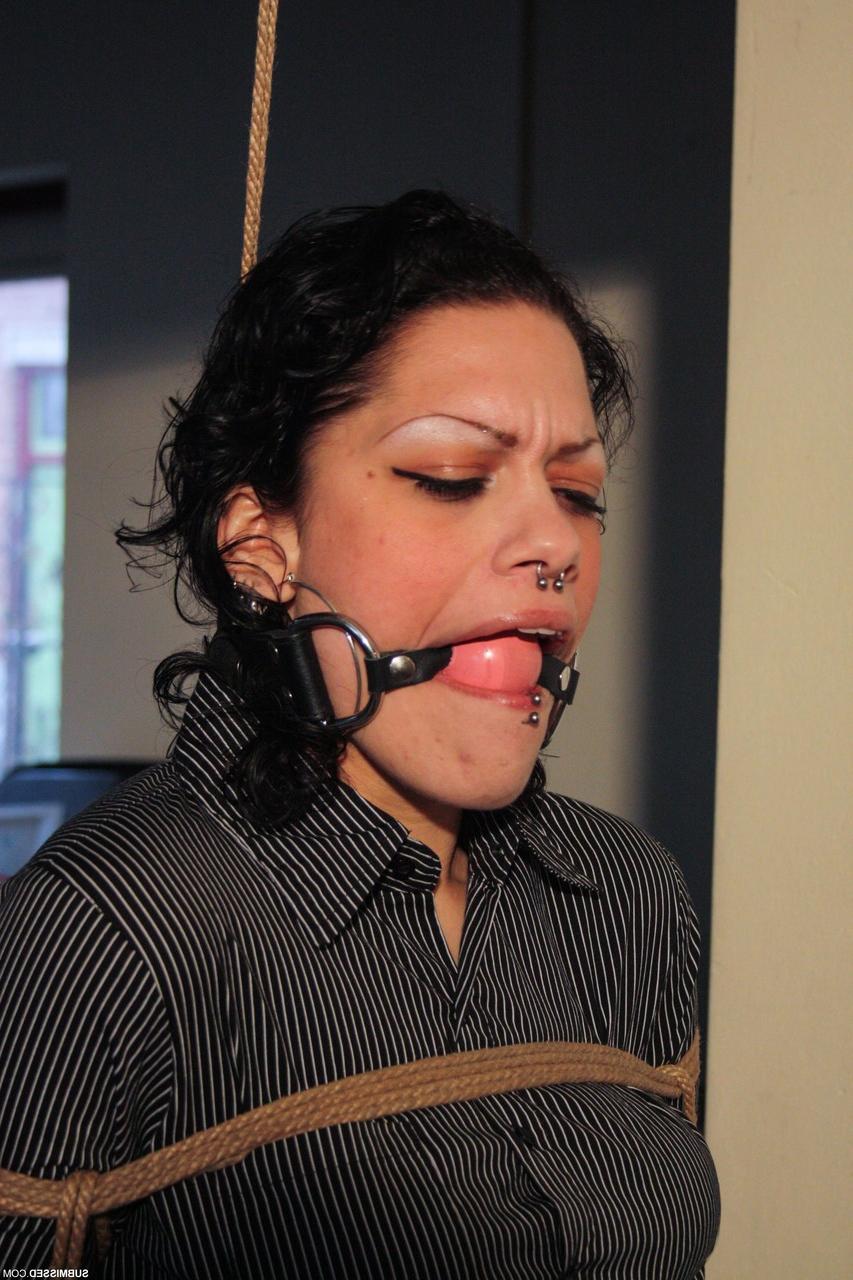 20P Ball-gagged clothed mature Steffi tries to free herself from rope bondage