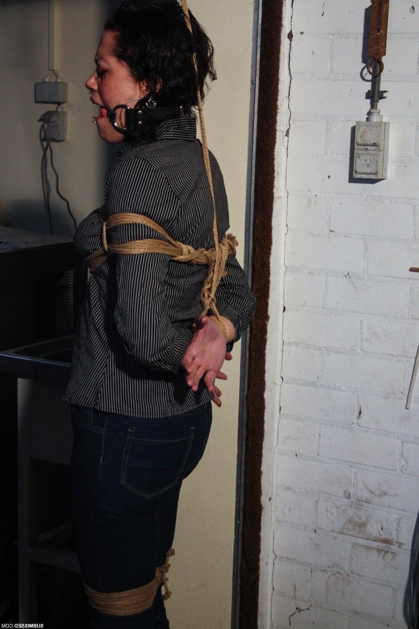 20P Ball-gagged clothed mature Steffi tries to free herself from rope bondage