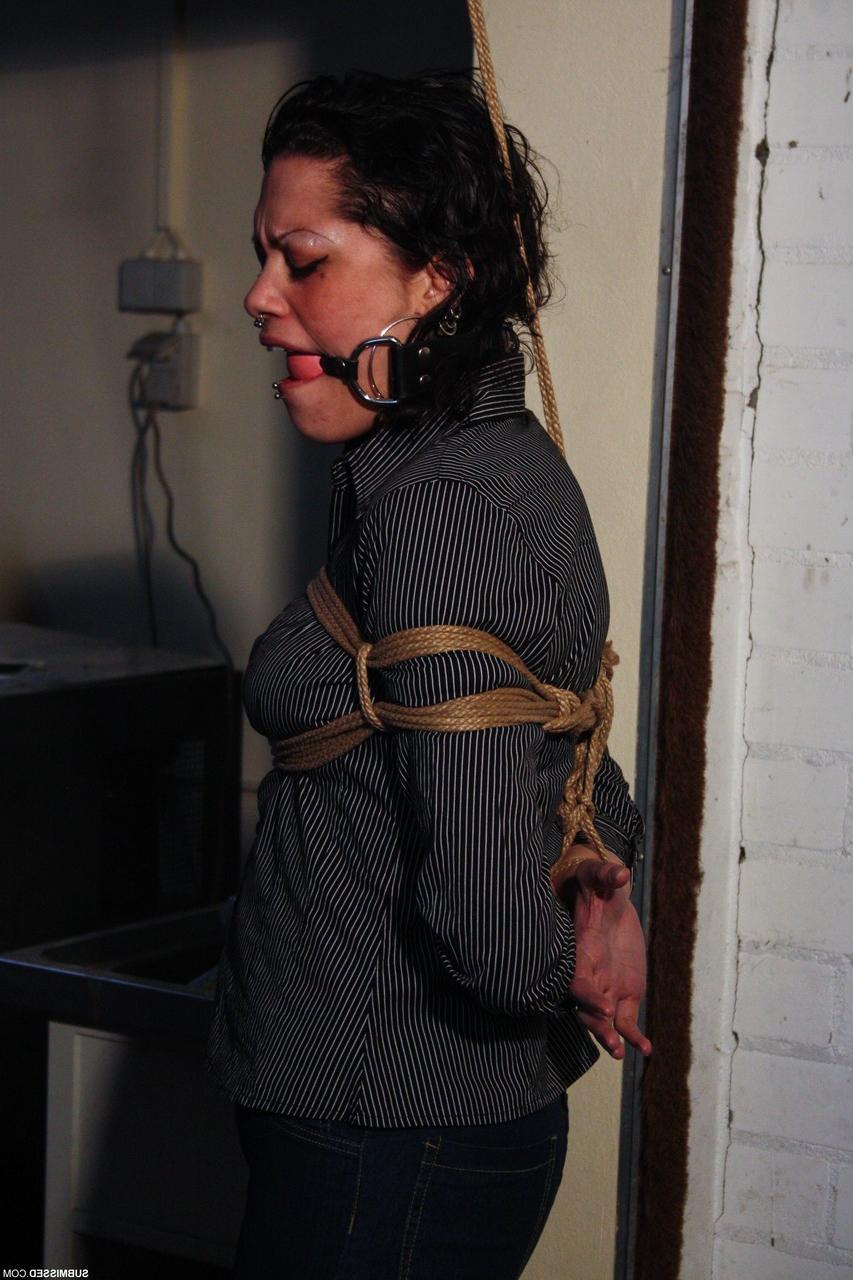 20P Ball-gagged clothed mature Steffi tries to free herself from rope bondage