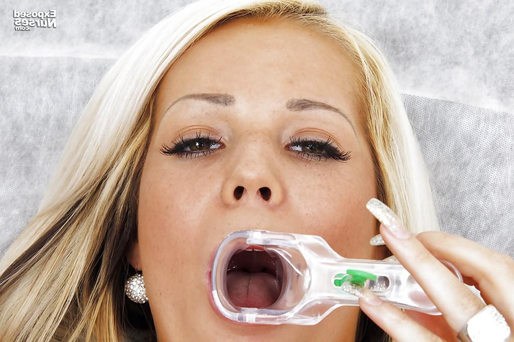 16P Sassy nurse hottie gets rid of her thongs and plays with a speculum