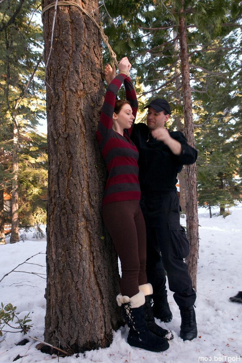 20P Hot babe Amber Keen gets tied to a tree and fingered on a cold winter day