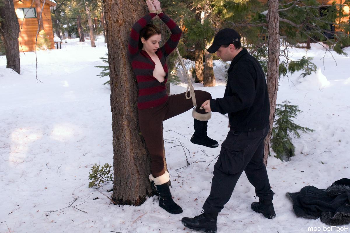 20P Hot babe Amber Keen gets tied to a tree and fingered on a cold winter day