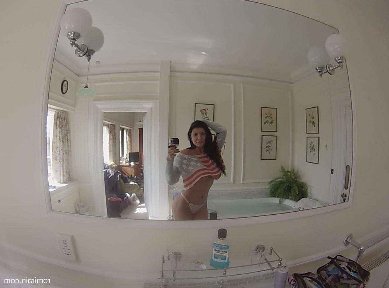 15P Attractive MILF Romi Rain strips and shows her curves before having a bath