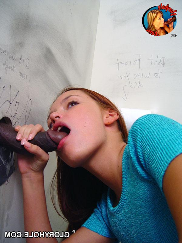 20P Redhead slut Saphire enjoys sucking a big black cock through a gloryhole