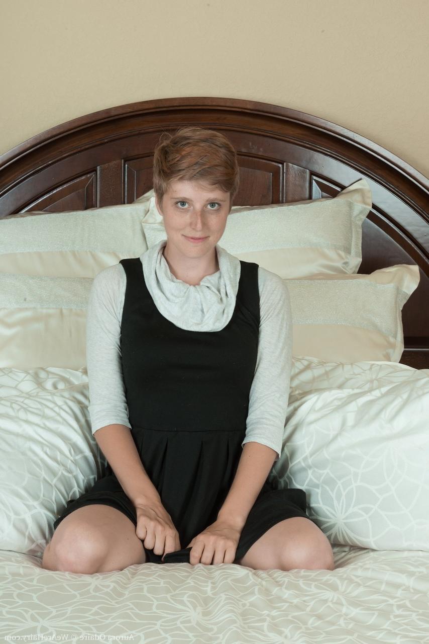 17P Short haired Aurora Odaire strips her clothes, shows nice tits and hairy twat