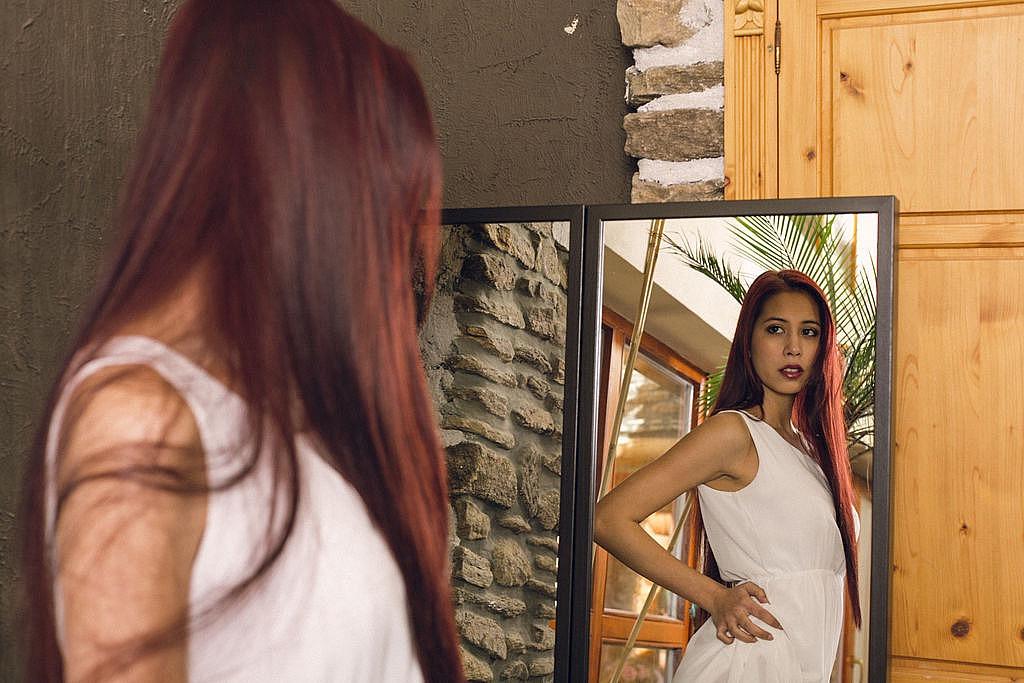 14P Long-haired teen Paula Shy looks in a mirror before a nude finger fuck